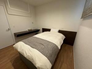 Ένα ή περισσότερα κρεβάτια σε δωμάτιο στο ラメールエトワレ