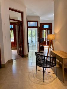 a living room with a chair and a table at Casa37 in Buenos Aires