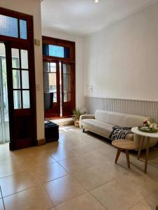 a living room with a couch and a table at Casa37 in Buenos Aires