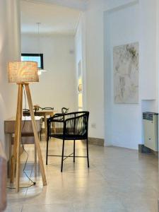 a chair and a lamp in a living room at Casa37 in Buenos Aires