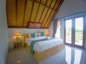 En eller flere senge i et værelse på The Bluhu Hill Cottage + 21 billeder