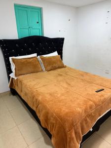 Giường trong phòng chung tại Cabañas Casa Campo Guatavita