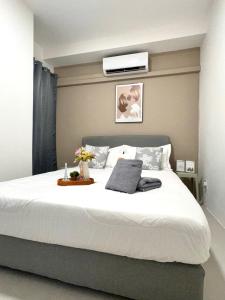 Ένα ή περισσότερα κρεβάτια σε δωμάτιο στο S6-03 Metrocity Square Condominium-3R2B-8 Pax +42 φωτογραφίες