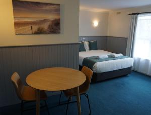 Postel nebo postele na pokoji v ubytování Central Motel Port Fairy