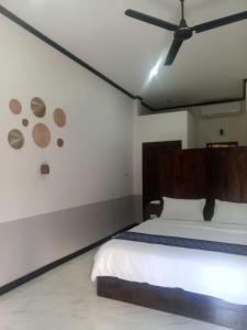 Ένα ή περισσότερα κρεβάτια σε δωμάτιο στο Le Charme Pakbeng Villa