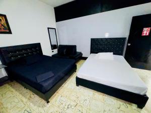 Postel nebo postele na pokoji v ubytování Apartaestudio san Jose