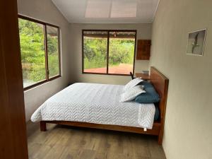 Ένα ή περισσότερα κρεβάτια σε δωμάτιο στο Cabaña Arjo