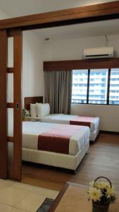 Ένα ή περισσότερα κρεβάτια σε δωμάτιο στο 103 Hotel +3 φωτογραφίες