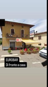 a building with a sign that reads eurobar dir promote a casas at Monolocale di Kris in Borgo a Giovi