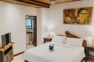 Un televizor și/sau centru de divertisment la Istana Balian - Boutique Hotel Resort