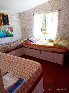 En eller flere senge i et værelse på La escondida