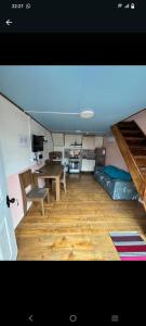 a living room with a table and a couch at Cabañas mateo 03 nuevo in Puerto Puyuhuapi