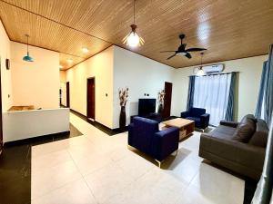 a living room with two couches and a table at Accra Luxury Apartments At The Sanga Estates in Accra
