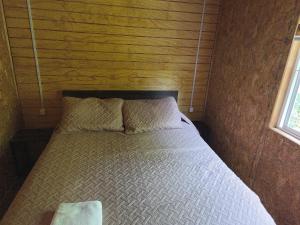 Ένα ή περισσότερα κρεβάτια σε δωμάτιο στο cabañas mateo 02 nuevo