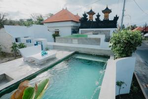 a swimming pool in the backyard of a house at MY BOO PRIVATE by DRAGONFLY in Nusa Penida