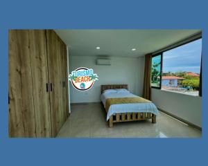 Postel nebo postele na pokoji v ubytování Palmares Beach