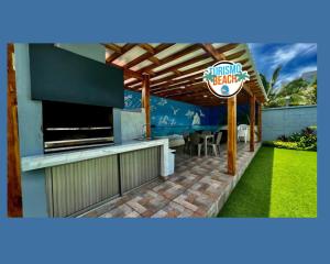 TV a/nebo společenská místnost v ubytování Palmares Beach