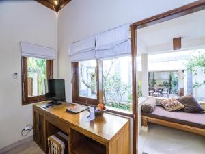 Un televizor și/sau centru de divertisment la Villa Diana Bali