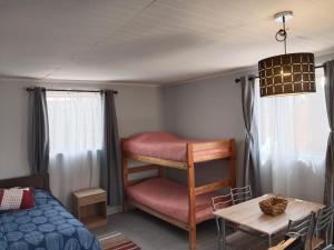 Giường trong phòng chung tại Hostal ribera de Quitor