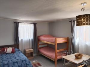 Giường trong phòng chung tại Hostal ribera de Quitor