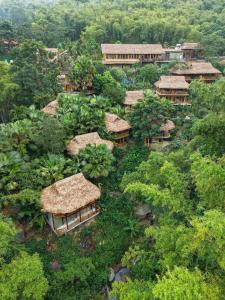an overhead view of a village with grass roofs at Asia Tropical Resort and Spa in Làng Coc