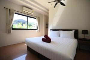 Postel nebo postele na pokoji v ubytování 4BR Pool Villa Rosso