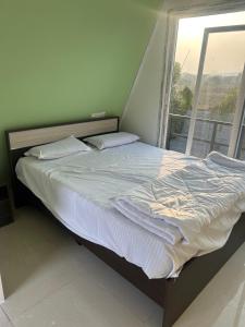 En eller flere senge i et værelse på mizzu