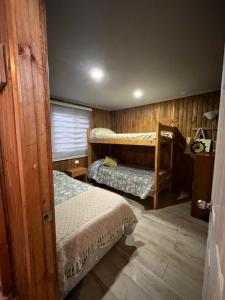 Ένα ή περισσότερα κρεβάτια σε δωμάτιο στο Cabaña en Las Brisas Navidad