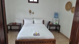 Ένα ή περισσότερα κρεβάτια σε δωμάτιο στο Ulutel Guest House