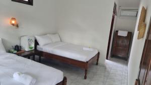 Ένα ή περισσότερα κρεβάτια σε δωμάτιο στο Ulutel Guest House