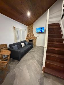 Μια τηλεόραση ή/και κέντρο ψυχαγωγίας στο Cabañas lindo amanecer +18 φωτογραφίες