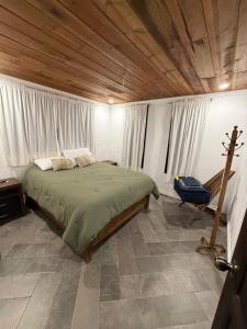 Ένα ή περισσότερα κρεβάτια σε δωμάτιο στο Cabañas lindo amanecer