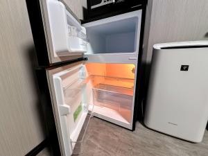 Kuchyň nebo kuchyňský kout v ubytování アミスタホテルアネックス