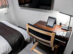 Postel nebo postele na pokoji v ubytování アミスタホテルアネックス