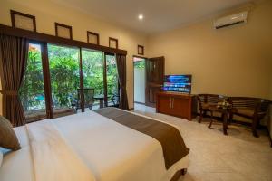 TV a/nebo společenská místnost v ubytování Gunakaya Homestay