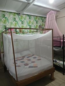 Postel nebo postele na pokoji v ubytování El Faro 13 de Puerto Viejo