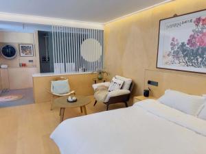 Postel nebo postele na pokoji v ubytování Shinewoo Hotel