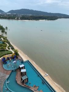 an overhead view of a swimming pool next to a beach at Grand Horizon Imperium Residence Kuantan Studio City view in Kuantan