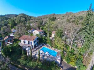 an aerial view of a house with a swimming pool at Huge Holiday Home in Marina di Castagneto Carducci near Sea in Donoratico