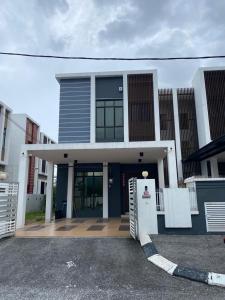 a house with a front porch with a door at 4 Bedroom 4 PRIVATE BATHROOM 4B12B 5 min City Center in Ipoh