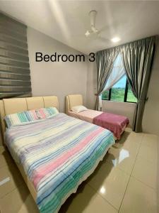 a bedroom with two beds and a window at 4 Bedroom 4 PRIVATE BATHROOM 4B12B 5 min City Center in Ipoh +14 photos