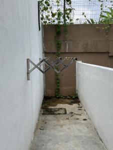 an empty alley with a metal object attached to a wall at 4 Bedroom 4 PRIVATE BATHROOM 4B12B 5 min City Center in Ipoh