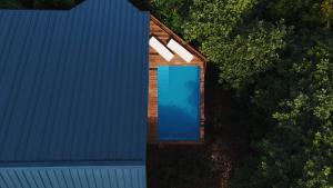 an overhead view of a house with a blue door at Turtle Beach Hotel Calibishie in Woodford Hill