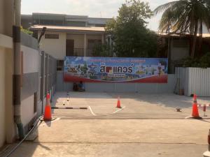 a parking lot with orange cones in front of a building at The Square Hotel เดอะสแควร์โฮเทลนครพนม in Nakhon Phanom +28 photos