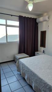 Una cama o camas en una habitación de Apartamento no Residencial Umuarama A