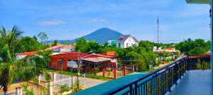 a view of a city with a mountain in the background at Arasam Homestay Bình An in Ấp Thanh Sơn (1)