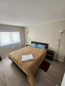 Ένα ή περισσότερα κρεβάτια σε δωμάτιο στο Departamento 2D y 2B New Cycle