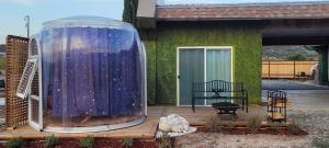 a gazebo sitting on a deck in front of a house at Stargazing Retreats Homestay in Camp Verde