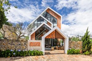 a house with an orange at Là Yên Retreat in Ấp Ða Lợi +96 photos