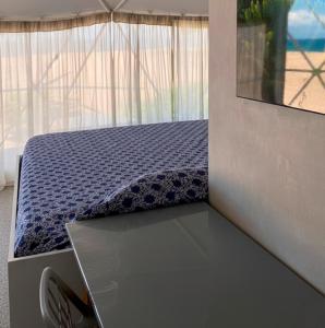 Ένα ή περισσότερα κρεβάτια σε δωμάτιο στο Ipala Glam Container +1 φωτογραφίες